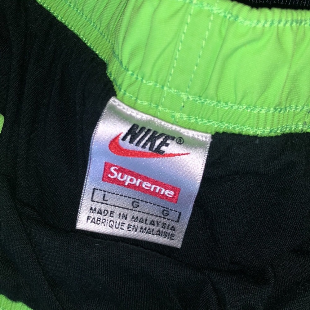 Green Nike supreme running pants